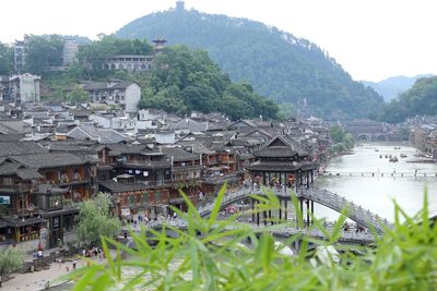 Scenic view of river by mountains