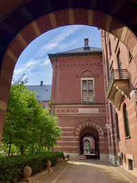 Street amidst buildings in town against sky