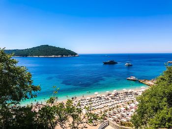 High angle view of sea against blue sky