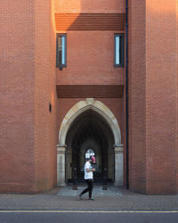 Woman standing in front of building