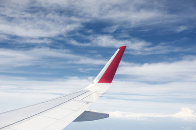 Low angle view of airplane flying in sky