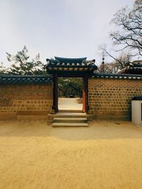 Entrance of temple against building