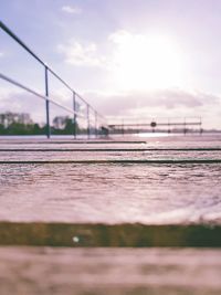 Surface level of landscape against cloudy sky