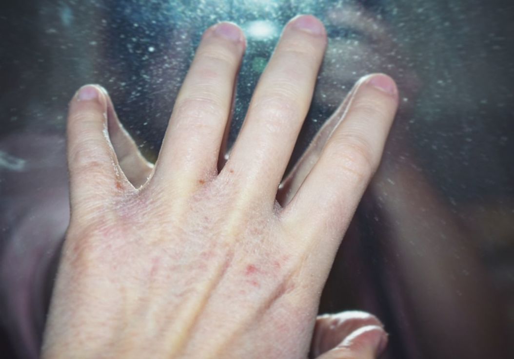 human hand, human body part, hand, body part, real people, human finger, one person, finger, personal perspective, close-up, unrecognizable person, day, high angle view, focus on foreground, lifestyles, outdoors, skin, leisure activity, human skin, raindrop
