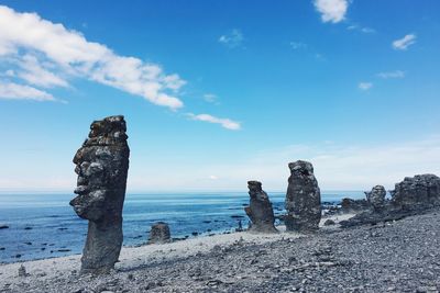 Scenic view of sea against blue sky