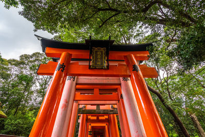  detail of the organge torii covering the scenic pathway of fushimi inari shrine, kyoto, japan