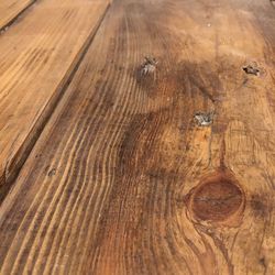 Close-up of wooden plank on table