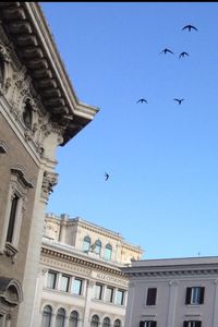 Low angle view of building against clear blue sky