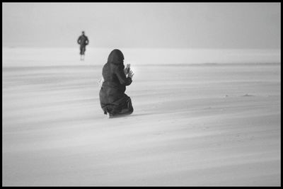 Full length of woman standing on beach