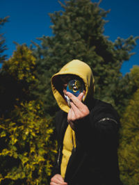 Teenage boy holding crystal ball