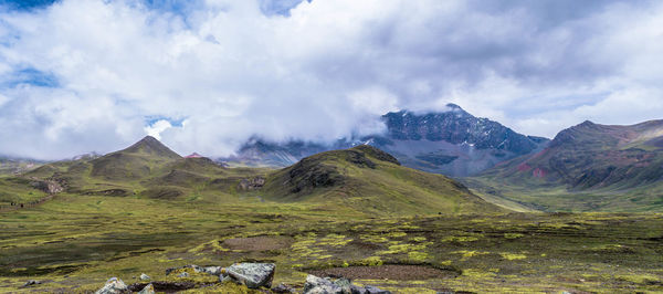 Panoramic view of mountains against cloudy sky