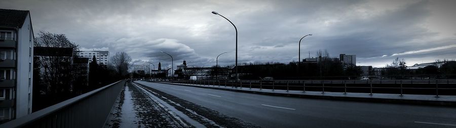 View of road against cloudy sky