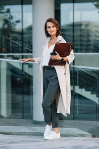 Portrait of young woman using mobile phone