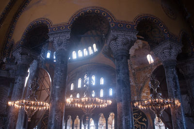 Low angle view of illuminated ceiling of building