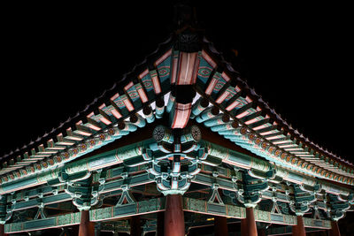 Low angle view of illuminated building at night