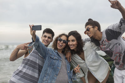 Portrait of young couple photographing