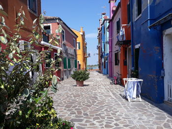 Alley amidst buildings in city