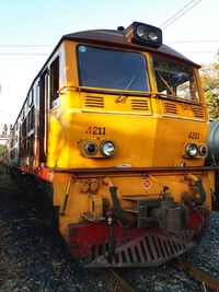 Train on railroad track against sky