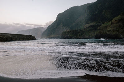 Scenic view of sea against mountains