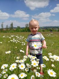 Full length of cute girl standing on field