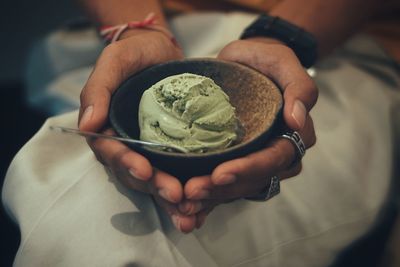 Midsection of person holding ice cream