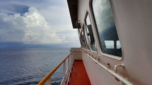 Close-up of ship on sea against sky