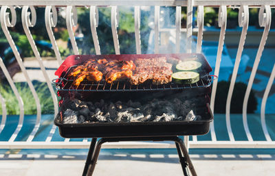 High angle view of meat on barbecue grill