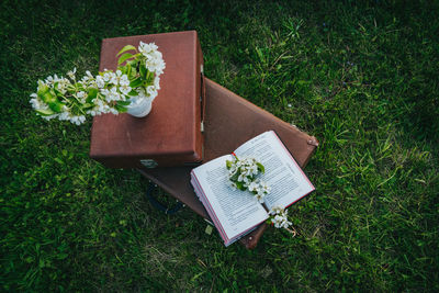 High angle view of open book on field