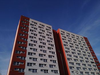 Low angle view of building against blue sky