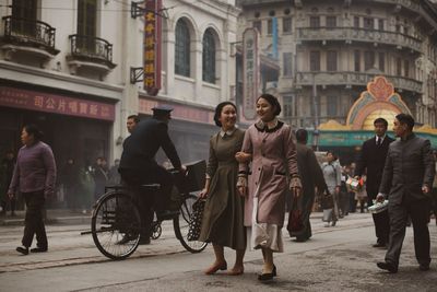 People walking on street in city