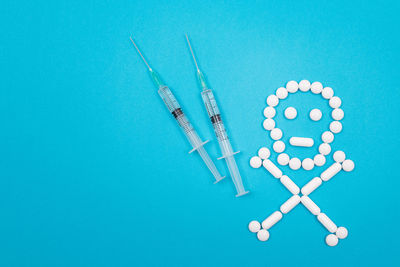 High angle view of clock on blue background