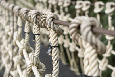 Close-up of rope tied on wooden post