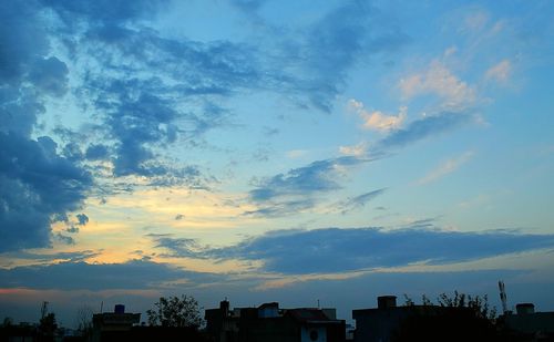 Scenic view of cloudy sky over city