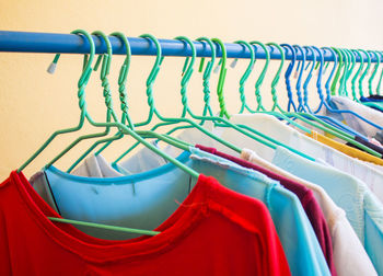 Close-up of clothes hanging on rack