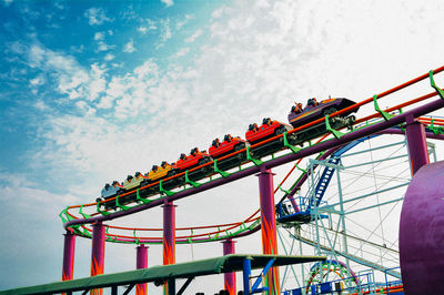 Low angle view of rollercoaster against sky