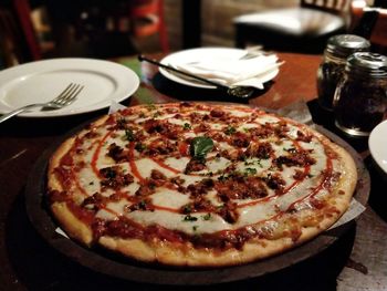 Close-up of pizza served on table