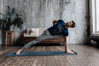 A man engaged in yoga and meditation, performing asanas