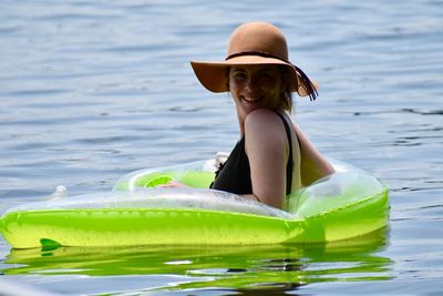 Woman wearing hat in sea