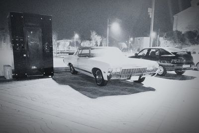 Cars on illuminated city at night