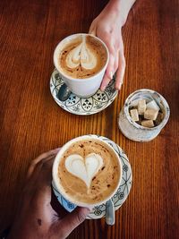 Midsection of coffee cup on table