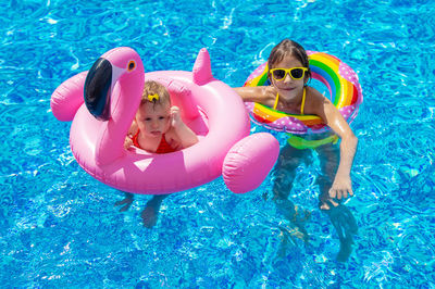 High angle view of woman swimming in pool