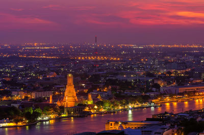 Illuminated buildings in city at night