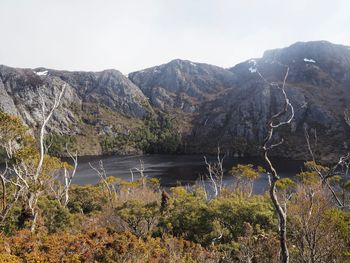 Scenic view of lake and mountains against sky