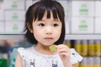 Portrait of cute boy eating food