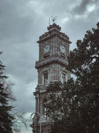 Low angle view of clock tower against sky