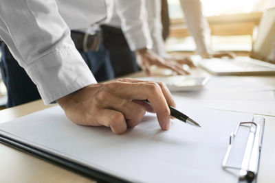 Close-up of man working on table