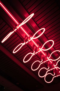 Low angle view of illuminated text on ceiling