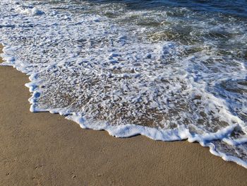 High angle view of surf on beach