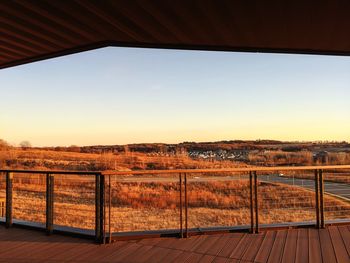 Scenic view of landscape against clear sky during sunset