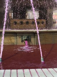 Woman jumping in water